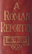 Gilt title, A Roman Reporter on the maroon spine of the book, with three gilt round floral emblems in a row, underneath the title.