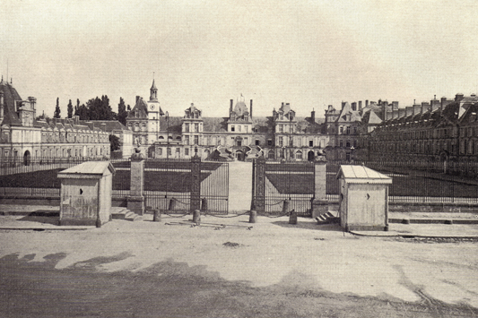 Black and white photograph of the palace of Fontainebleau, France, taken in the late 19th century.