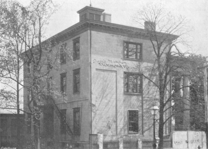 Black and white photograph of a three story square house, the home of Jefferson Davis.