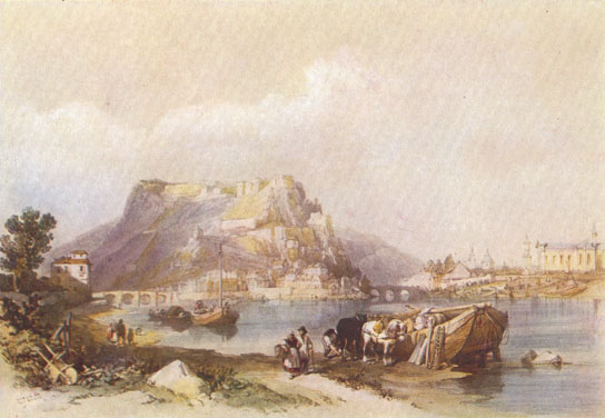 Colored drawing of a medieval fortress with stark walls on a mountain-top in the background, overlooking a village.  A river with a large boat is in the foreground with horses and people on the bank next to it.