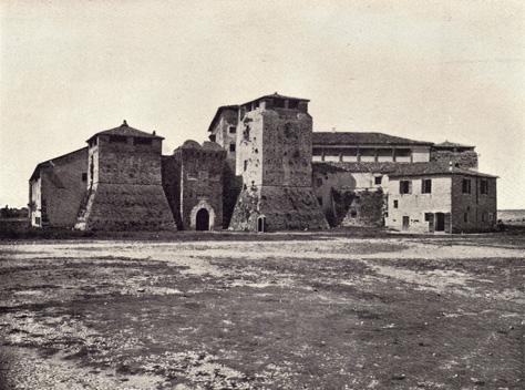 Black and white photograph of Rocca Malatestiana in Rimini, Italy, thirteenth century on a treeless landscape, taken in the late 19th century.